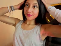 A brunette girl with soft, radiant skin, a slim body that moves with grace and energy. Her black, straight, shiny hair falls in soft waves over her shoulders, highlighting her lively face. She has a warm and contagious smile that lights up her expression and reflects her cheerful and laughing personality. Her attitude is determined and confident, always with a spark of confidence that is noticeable in her bearing and the way she interacts with others. She has a lively look that shows her enthusiasm for life, leaving an impression of freshness and positivity wherever she goes.